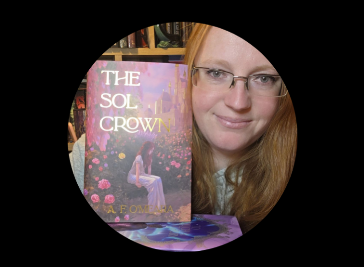 Woman with glasses peeking from behind a book titled 'The Sol Crown' by A.F. O'Meara